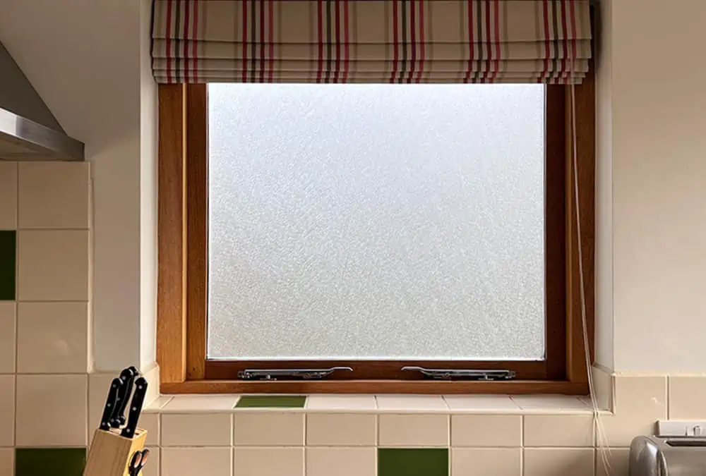 Web Effect frosted window film applied to a kitchen window adding privacy